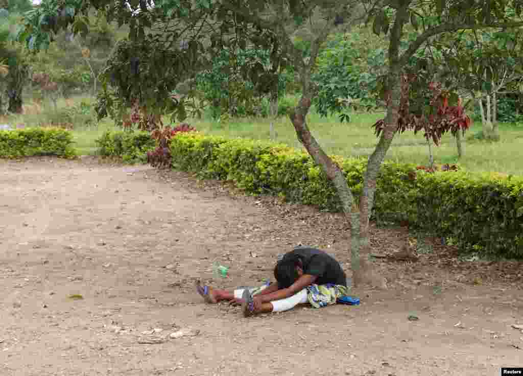 The mother of a baby suspected of dying from Ebola, cries outside a hospital in Beni, North Kivu Province of Democratic Republic of Congo, Dec. 15, 2018.