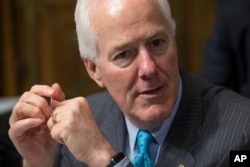 FILE - Sen. John Cornyn, R-Texas, the Senate majority whip, arrives for hearing at the Senate Judiciary Committee on Capitol Hill in Washington, March 16, 2016.