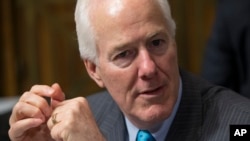 FILE - Sen. John Cornyn, R-Texas, the Senate majority whip, arrives for hearing at the Senate Judiciary Committee on Capitol Hill in Washington, March 16, 2016.