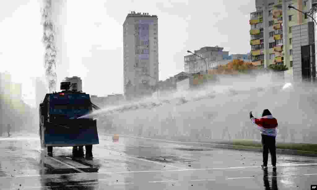 Police use a water cannon against demonstrators during a rally in Minsk, Belarus.