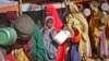 FILE - Women who fled drought queue to receive food at a camp for internally displaced persons, in the Daynile neighborhood on the outskirts of the capital Mogadishu, Somalia, May 18, 2019. 