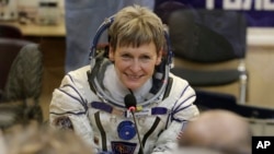 U.S. astronaut Peggy Whitson, member of the main crew of the expedition to the International Space Station, speaks with her relatives prior the launch of Soyuz MS-3 space ship at the Russian-leased Baikonur cosmodrome, Kazakhstan, Nov. 17, 2016.