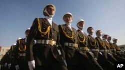 FILE - Afghan National Army cadets march during a graduation ceremony at National Military Academy of Afghanistan in Kabul, Afghanistan, Tuesday, March 16, 2010.