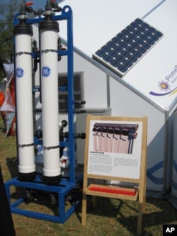 Solar panel and GE water purifier on the HabiHut shelter roof