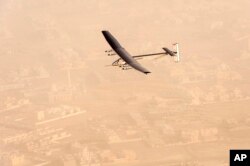 FILE - In this photo released by Solar Impulse, "Solar Impulse 2", a solar-powered airplane flies after taking off from Al-Bateen Executive Airport in Abu Dhabi, United Arab Emirates, March 9, 2015.