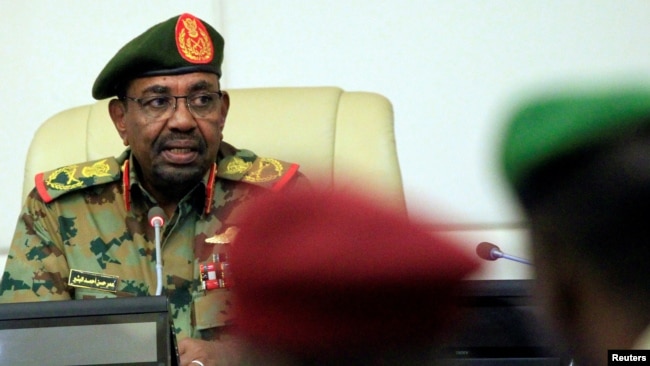 FILE - Sudan's President Omar al-Bashir is seen during a swearing-in ceremony of new officials after he dissolved the central and state governments in Khartoum, Sudan, Feb. 24, 2019.