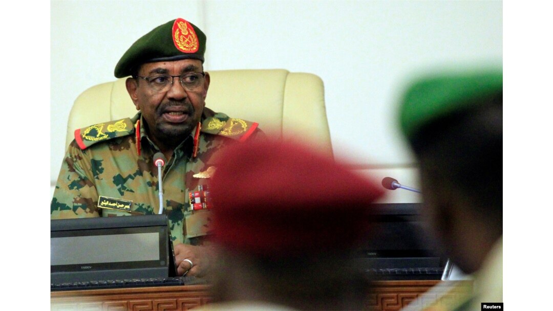 FILE - Sudan's President Omar al-Bashir is seen during a swearing-in ceremony of new officials after he dissolved the central and state governments in Khartoum, Sudan, Feb. 24, 2019.