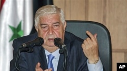 Syrian Foreign Minister Walid Moallem speaks during a news conference in Damascus, June 22, 2011