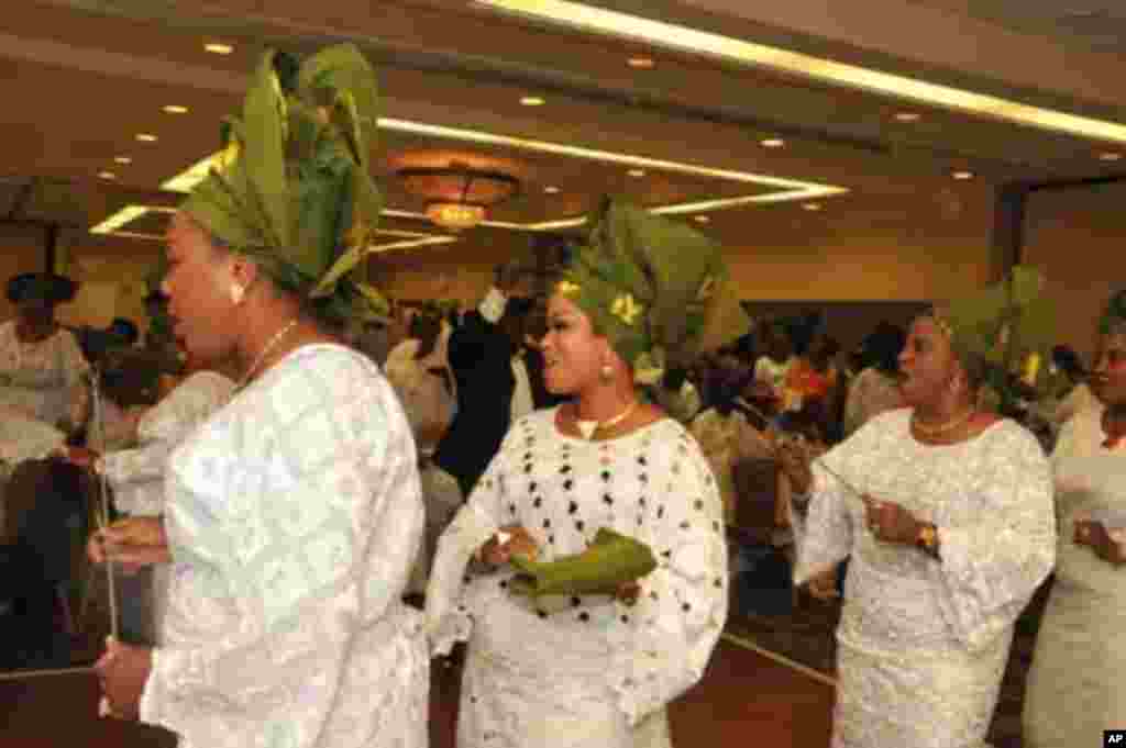 Singing and dancing by the Owo cultural ensemble in honor of the King and Queen of Owo