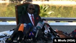 FILE - Former Zimbabwean President Robert Mugabe addresses journalists at his residence in Harare, July 29, 2018.