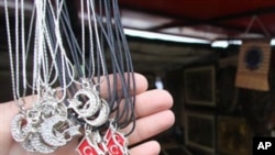 A vendor displays chains with a pendants in the shape of Turkish flag at a market. Over the past ten years, Turkey’s economy has grown by over $500 billion.