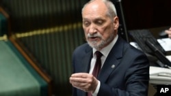 FILE - Polish Defense Minister Antoni Macierewicz speaks during a parliamentary debate in Warsaw, Poland, May 24, 2017.