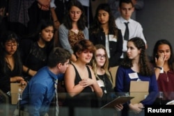 Students from Marjory Stoneman Douglas High School and those supporting them react, Feb. 20, 2018.