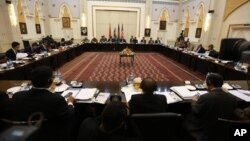 FILE - Delegations from Afghanistan, Pakistan, the United States and China discuss a road map for ending the war with the Taliban at the Presidential Palace in Kabul, Afghanistan, Feb. 23, 2016.