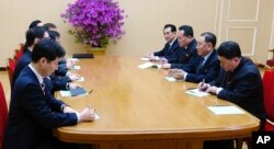 In this photo provided by South Korea Presidential Blue House via Yonhap News Agency, Kim Yong Chol, vice chairman of North Korea's ruling Workers' Party Central Committee, second from right, talks with South Korean delegation in Pyongyang, North Korea.