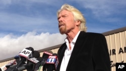 Virgin Galactic founder Richard Branson, speaking to reporters in Mojave, Calif., salutes the bravery of pilots who were testing his spacecraft, Nov. 1, 2014.