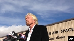 Virgin Galactic founder Richard Branson, speaking to reporters in Mojave, Calif., salutes the bravery of his company's test pilots, Nov. 1, 2014.