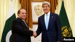 FILE - U.S. Secretary of State John Kerry (R) shakes hands with Pakistan's Prime Minister Nawaz Sharif in Islamabad August 1, 2013.