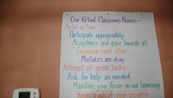 A list of virtual classroom norms hangs on Aimee Rodriguez Webbwall in her virtual classroom for a Cobb County school, on Tuesday, July 28, 2020, in Marietta, Ga.