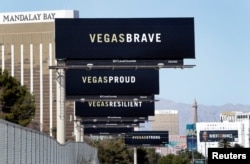 Billboards are shown on Las Vegas Boulevard South near the "Welcome to Las Vegas" sign in Las Vegas, Nevada, Oct. 9, 2017.