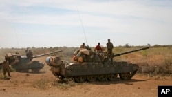Somalia Al-Shabab's Resurgence: FILE - In this Wednesday, Feb. 29, 2012 file photo, Ethiopian military tanks sit in position on the outskirts of the town of Baidoa in Somalia. 