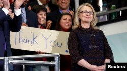 Former U.S. Secretary of State Hillary Clinton receives applause on her last day in office at the State Department, Feb. 1, 2013.