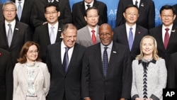 (front row) U.S. Secretary of State Hillary Clinton (R) and U.S. Trade Representative Ron Kirk (2nd R) pose with Russia's Foreign Minister Sergei Lavrov (2nd L) and Russian Minister of Economic Development Elvira Nabiullina (L) during the APEC Ministerial