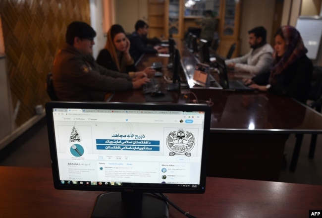 In this photo taken on Feb. 6, 2019, the Twitter page of Taliban spokesman Zabihullah Mujahid is pictured on a computer monitor in the newsroom at Maiwand TV station in Kabul.