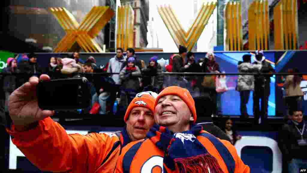 Fans Todd Barnes and Mitch Daniels photograph themselves on Super Bowl Boulevard in Times Square prior to Super Bowl XLVIII, Jan. 31, 2014, in New York City.