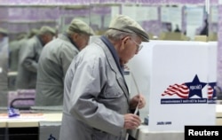 FILE - Henry Martin, 80, votes in Chicago, Illinois, Nov. 2, 2004.