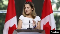 FILE - Canadian Foreign Minister Chrystia Freeland takes part in a news conference at the Embassy of Canada in Washington, Aug. 31, 2018. 