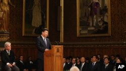 China's President Xi Jinping addresses members of parliament and peers in Parliament's Royal Gallery, in London, England, Oct. 20, 2015.