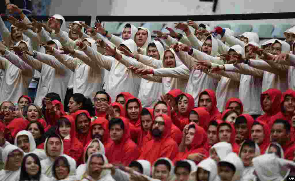 Mexico's fans perform before the start of the of the Mexico vs Israel friendly football match at Azteca stadium in Mexico City, May 28, 2014.