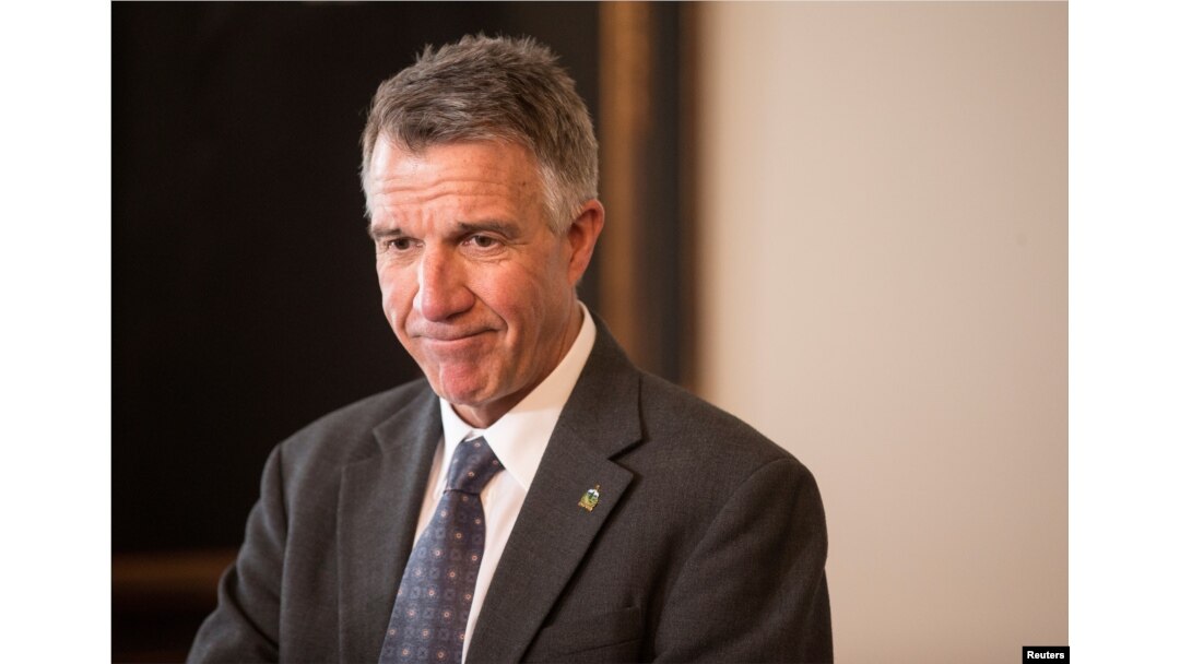 FILE - Vermont Gov. Phil Scott speaks to reporters in his offices at the State Legislature in Montpelier, March 13, 2018.