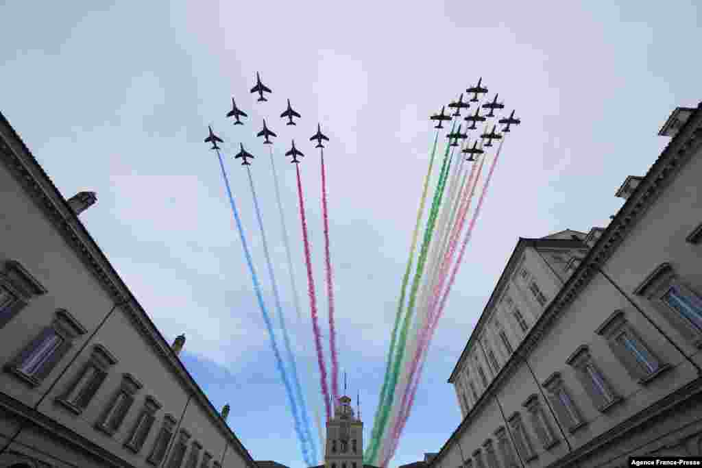 Italian and French air force jets fly above the Quirinale Presidential Palace in Rome to mark the signing of the Franco-Italian Quirinal Treaty.