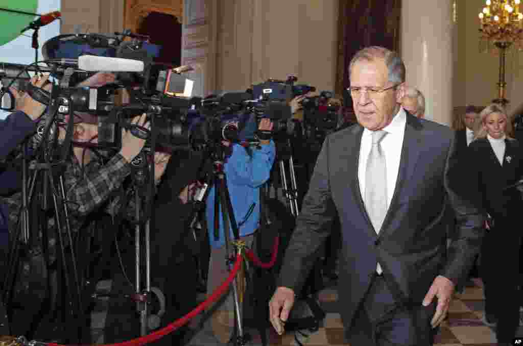 Russian Foreign Minister Sergei Lavrov leaves the French Foreign Affairs Ministry following a meeting on a peace deal for Ukraine, in Paris, Feb. 24, 2015.