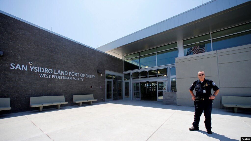 A U.S. Customs and Border patrol officer stands at the exit into the United States during a media tour of the new pedestrian port of entry from Mexico to the United States in San Ysidro, California, June 30, 2016.