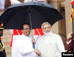 India's Prime Minister Narendra Modi shakes hands with Sri Lanka's President Maithripala Sirisena during his welcome ceremony at the Presidential Secretariat in Colombo, Sri Lanka, June 9, 2019.