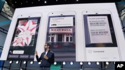 Google CEO Sundar Pichai talks about Google Lens and updates to the Google Assistant during the keynote address of the Google I/O conference in Mountain View, California, May 17, 2017. 