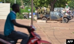 Burkina Faso's troops patroll in Ouagadougou on Sept. 17, 2015.