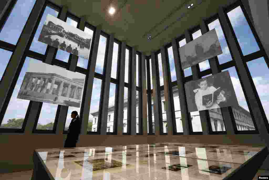 A woman walks through the Munich Documentation Center for the History of National Socialism, in Munich, Germany.&nbsp; The official inauguration of the visitor center marks the 70th anniversary of the liberation of Munich by U.S. troops.