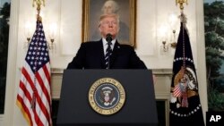 FILE - President Donald Trump makes a statement at the White House in Washington, Oct. 2, 2017. Officials say that he will announce his decision on the United States' continued participation in the Iran nuclear deal in a speech tentatively scheduled for October 12.