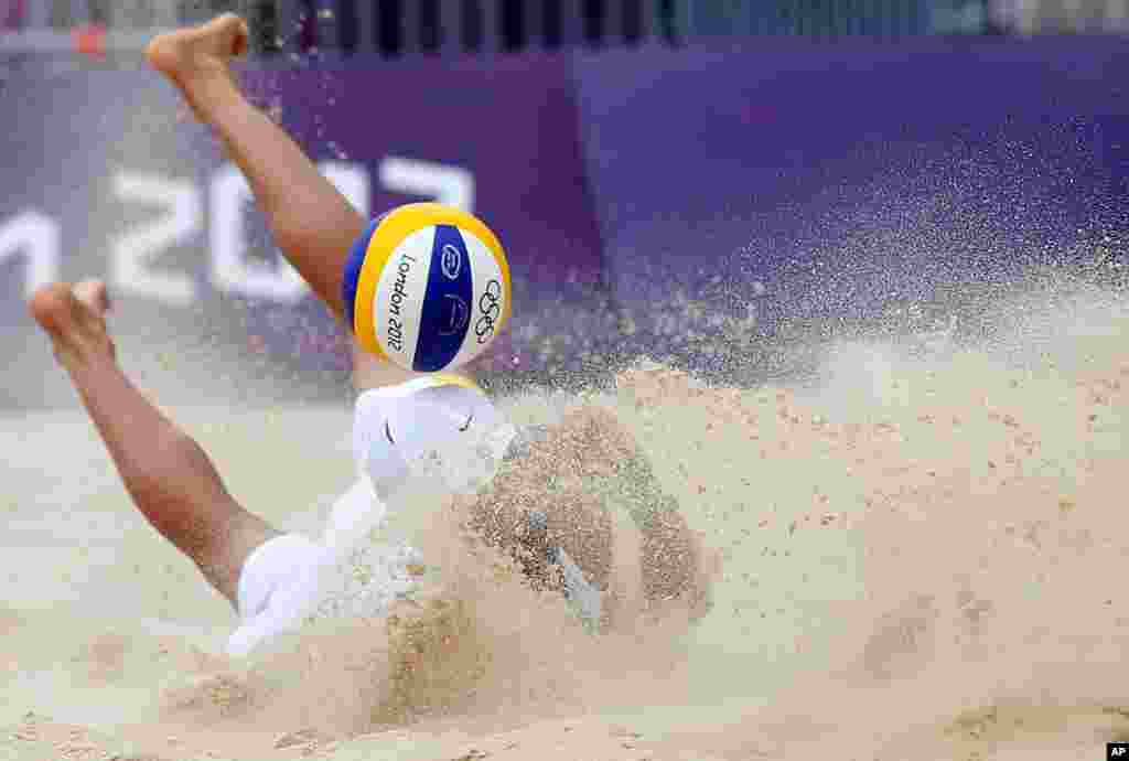 Spain's Pablo Herrera Allepuz misses the ball during a beach volleyball match against Japan.