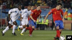 Spain's David Villa, right, takes a penalty kick during the World Cup group H soccer match between Spain and Honduras at Ellis Park Stadium in Johannesburg, South Africa, Monday, June 21, 2010.