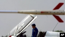 A Chinese pilot looks out from the cockpit of a Chinese made F7 jet parked at the People's Liberation Army's 24 Air Division airbase in the suburbs of Tianjin, 70 kilometers (44 miles) southeast of Beijing, (File)