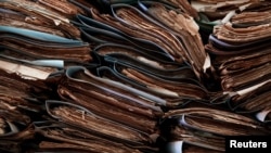 South Sudan's archives, including photographs, documents, books, and papers are seen inside a tent in the capital Juba, May 18, 2012. 