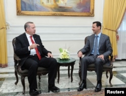Syria's President Bashar al-Assad, right, meets Turkey's Prime Minister Tayyip Erdogan in Aleppo, Feb. 6, 2011.