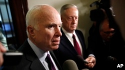 Sen. John McCain, R-Ariz., left, and Defense Secretary James Mattis, speak to members of the media after their meeting on Capitol Hill in Washington, Oct. 20, 2017. 