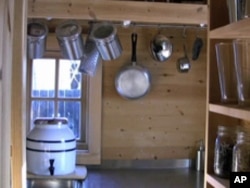 The kitchen in Jay Shafer's tiny home includes a small gas stove and sink .