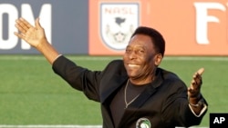 FILE - Brazilian soccer legend Pele waves to the crowd during a pregame ceremony before an NASL soccer game.